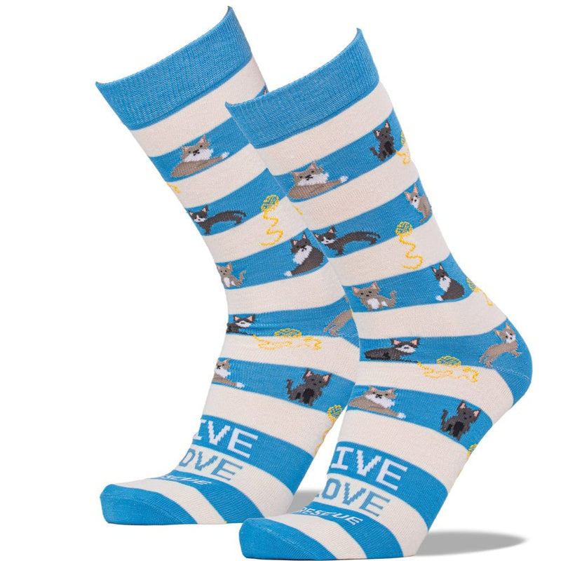A pair of crew socks with blue and cream horizontal stripes, featuring a playful pattern of cartoon cats and yarn balls, with the word 'LOVE' printed on the toes.