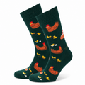 Dark green socks with rooster and chicken pattern on a white background