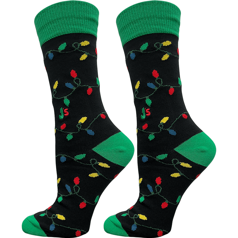 Black socks with colorful Christmas light pattern and green cuffs and toes on a white background