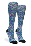 Colorful mermaid scale pattern knee-high socks on a white background