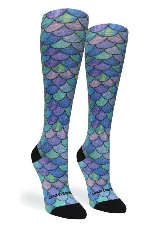 Colorful mermaid scale pattern knee-high socks on a white background