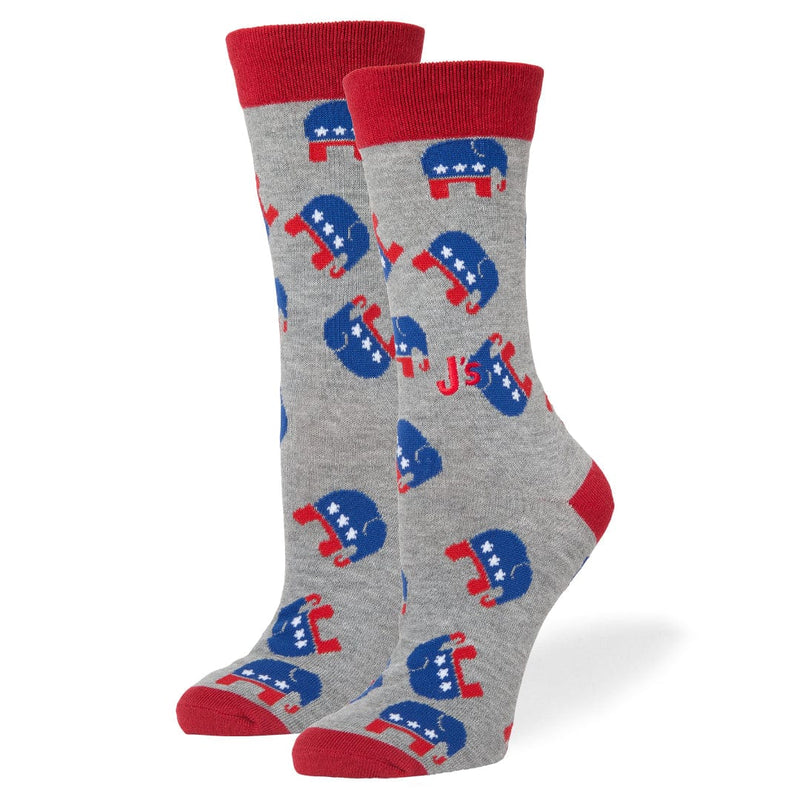 A pair of heather gray crew socks with red cuffs, heels, and toes, featuring a repeating blue and red Republican elephant logo pattern and the red text 'MAKE AMERICA GREAT' printed on the side.